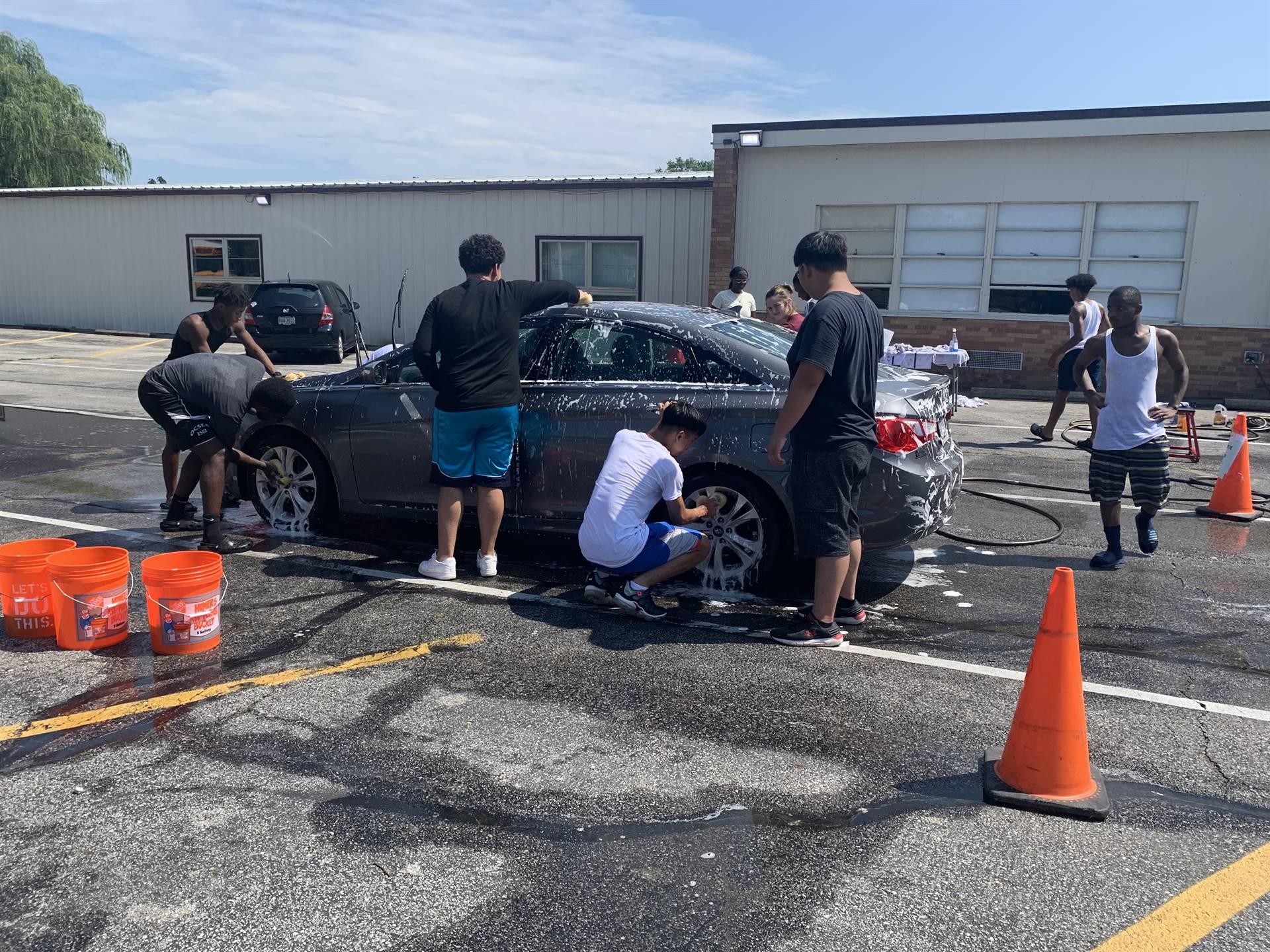Students washing a car