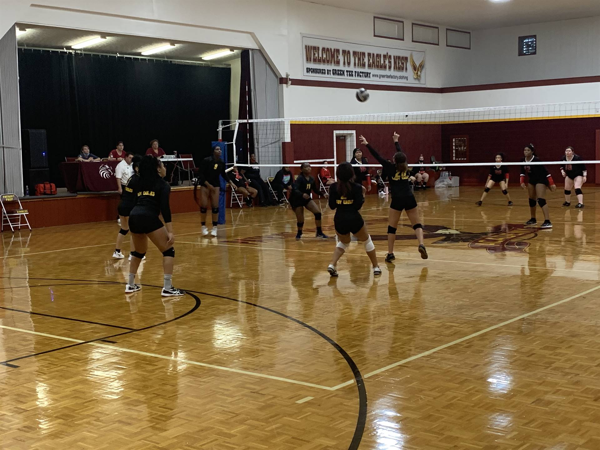 students playing volleyball in the gym