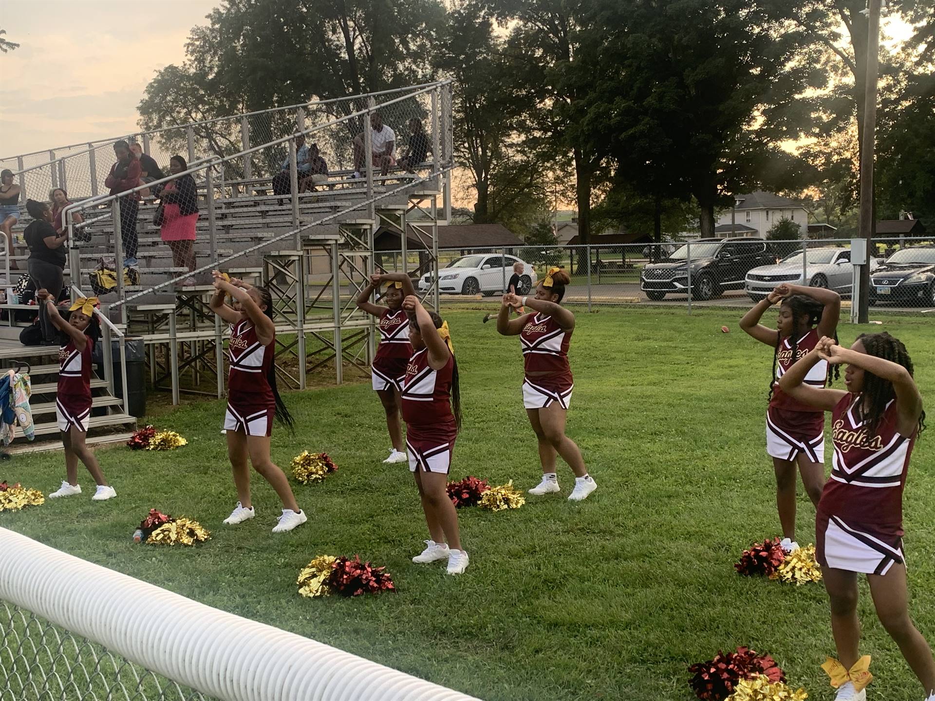 cheerleaders on side of football field